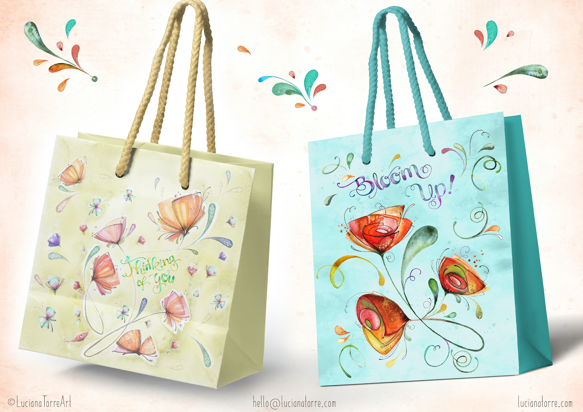Two decorative gift bags featuring hand-painted watercolor illustrations of vibrant flowers and butterflies. One bag is light green with the phrase 'Thinking of You' and pink flowers, while the other is blue with the phrase 'Bloom Up!' and red-orange flowers.